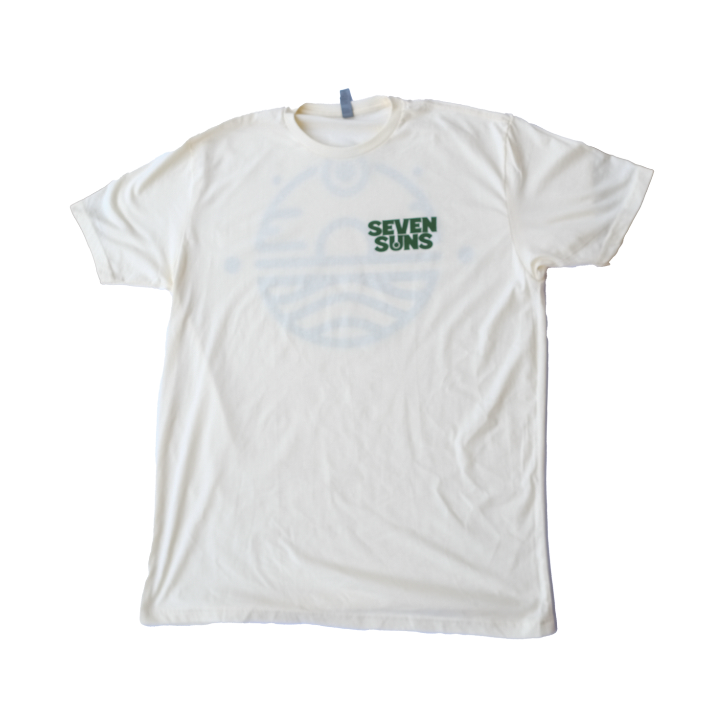 Green Seven Suns Logo on Sand colored shirt